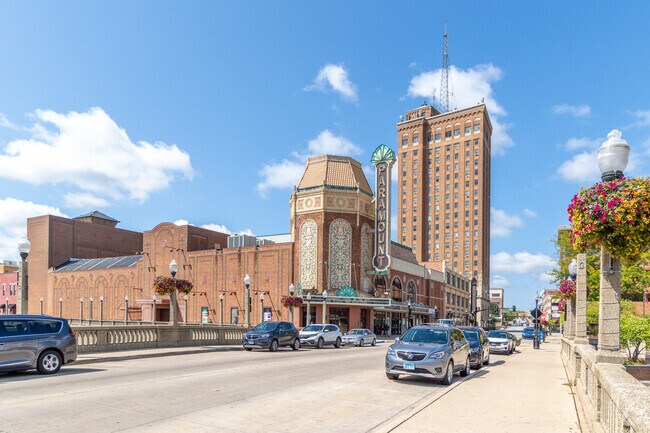 The iconic Paramount Theater sits along the river near McCarty Burlington.