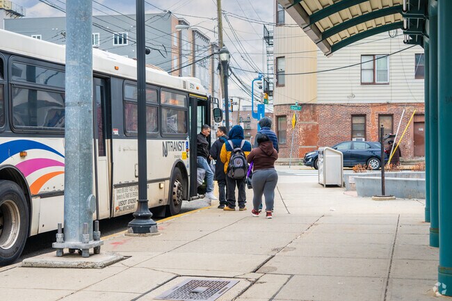 West Side Avenue has a bus station located right next to a lightrail station and travels to NYC.