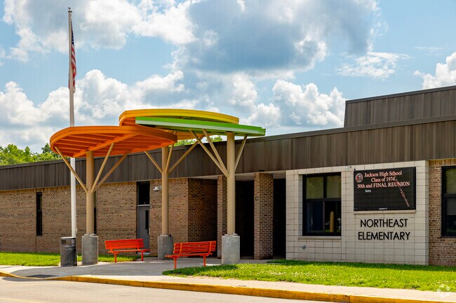 The main entrance to Northeast Elementary School features a playfull and colorful shade.