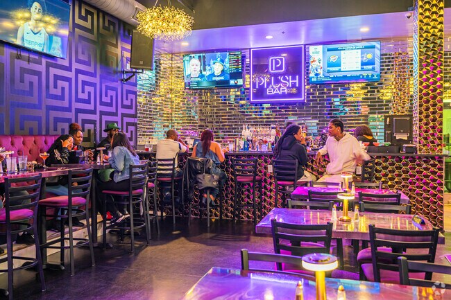 Plush is a soul‑food lounge with purple‑gold flair, live DJs, and weekend nightlife.