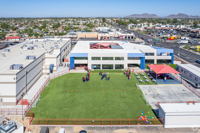 A vast open field for students to play and explore at Synergy Public School in Phoenix.