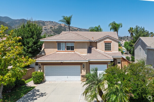 Nestled against the mountains, the Wildrose neighborhood is decorated with many trees.