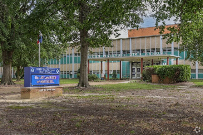 The welcome sign and front entrance of John Marshall High School welcomes older learners.