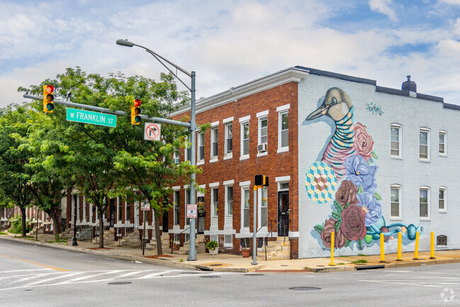 Murals can be found throughout Lexington including on the ends of rowhomes.