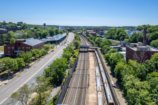 Trains passing by in Roxbury Crossing Train station in Fort Hill