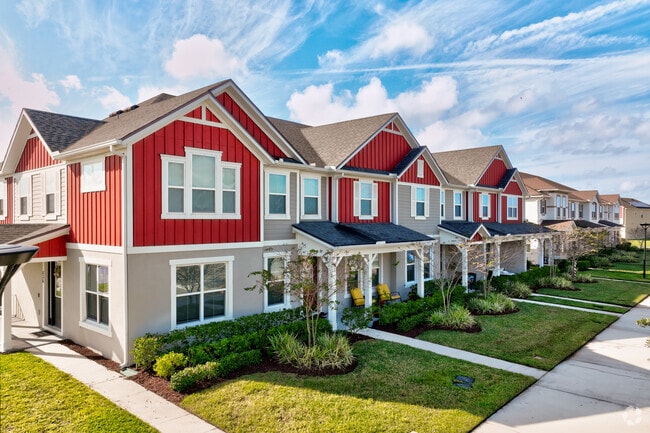 A colorful row of newly constructed townhomes stands out in the Mill Slough neighborhood in Kissimmee.