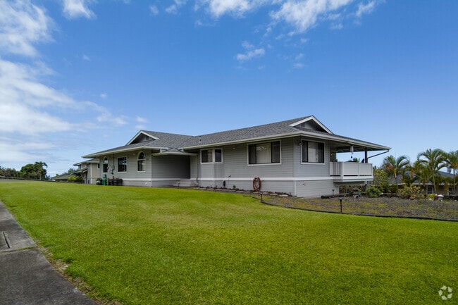 Many homes have beautifully manicured lawns.