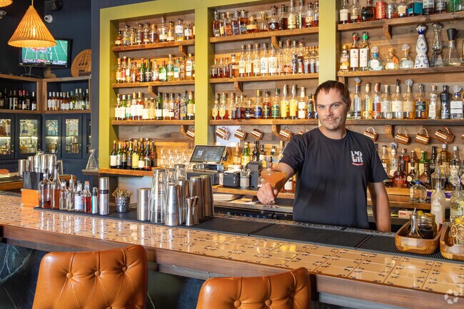 Pour’s back bar offers specialty cocktails like Lady Rosa in River Ranch, Lafayette.