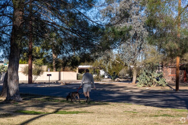 Morning walkers enjoy Pinecrest Park for it's shade and green space.