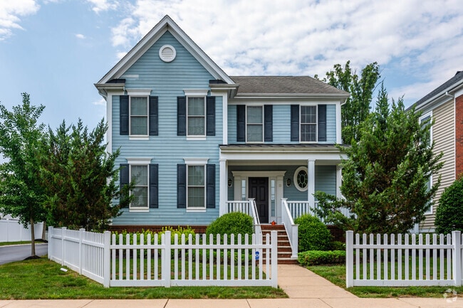Some colonial homes showcase color like dark blue accent shutters in Plainsboro.