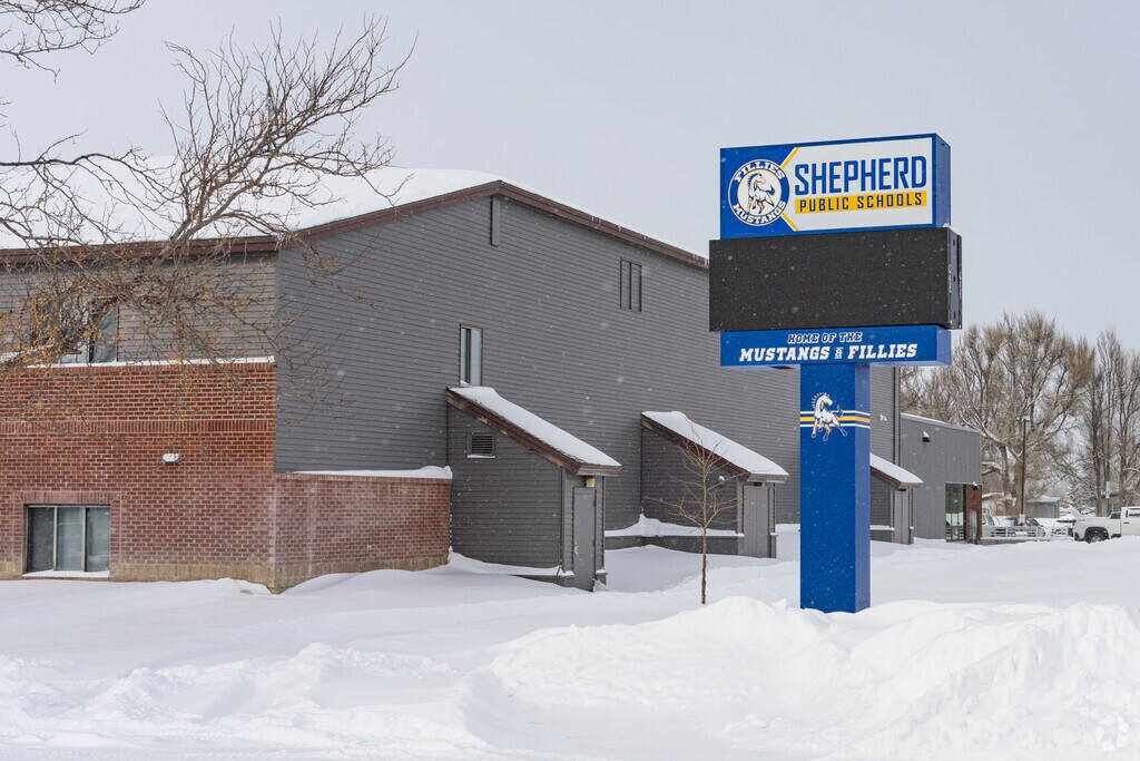 A lighted marquee at Shepherd High School displays upcoming events.