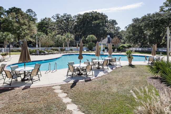 Wachesaw Plantation Club has a large pool with tables and chairs at Wachesaw Plantation.