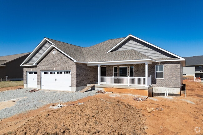 New brick ranch homes with two-car garages bring modern living to Farmington, MO.