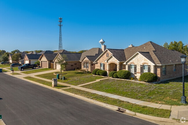 Newer traditional homes in Aubrey typically feature brick facades and front facing windows.
