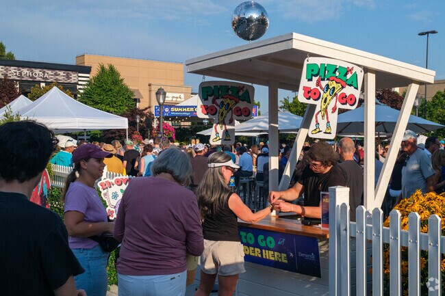 Locals can enjoy some pizza and drinks at the Summer Concert Series in U Village.