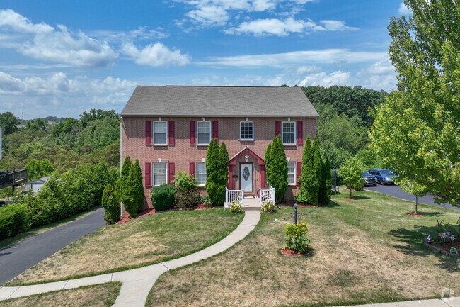 A colonial-style home in Robinson Township offers space and comfort for a growing family.