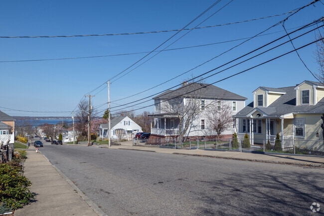Established homes in the Sandy Beach neighborhood have a classical styling typical of New England cities.