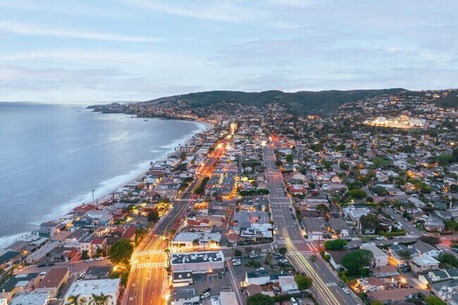 The dramatic scenery of Laguna Beach, with its rugged coastline and peaceful beaches, becomes even more mesmerizing as the fading daylight enhances the colors of the landscape.