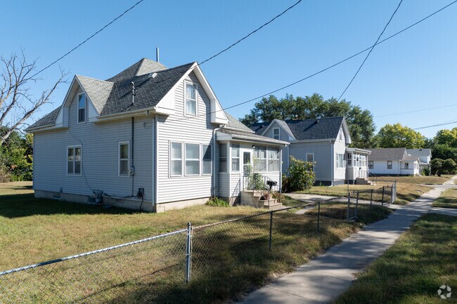 Some homes in the neighborhood of We Care are fenced off.