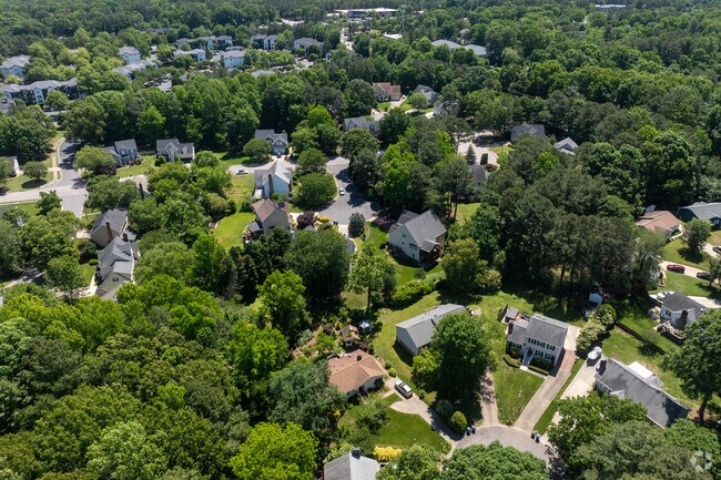 The Brookhaven neighborhood is tucked away under dense foliage.