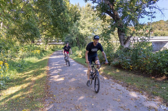Cyclists soak up the sunshine along the Kishwaukee River Path in Cherry Valley.