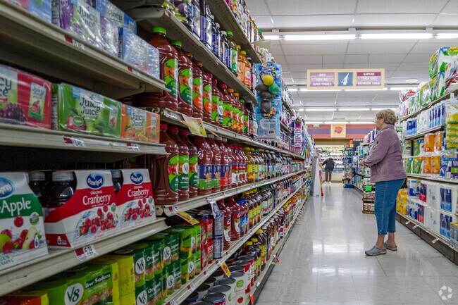 A Redbank Township resident shops for groceries at Riverside Quality Foods.