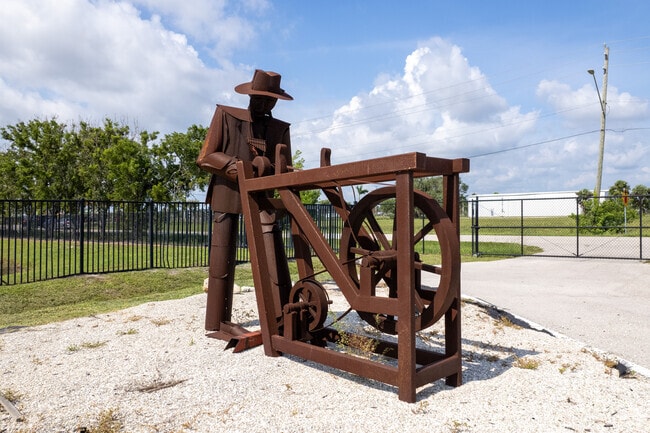 Apostolic Revival Center Christian School in Fort Myers has a metal artwork piece of a farmer.