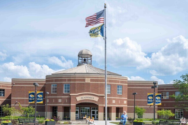 Neuqua Valley High School located near Saddle Creek offers college credit opportunities.