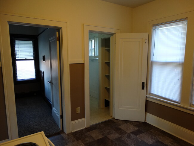 View from Kitchen to Bedroom 2 on left, Bathroom Door on Right