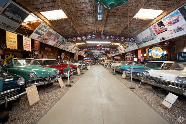 Muscle cars and vintage neon signs at Deer Park Winery in Hidden Meadows.