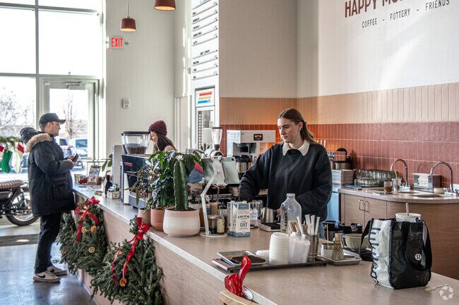 Start your morning at Happy Monday & Company Coffee near Sandcastle.