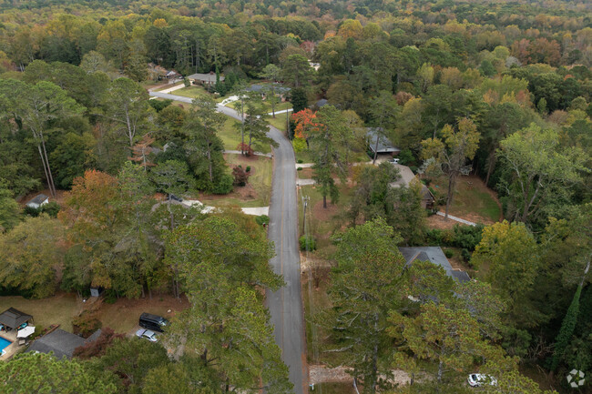 Green - Crestwood homes are surrounded by tall trees and lush greenery.