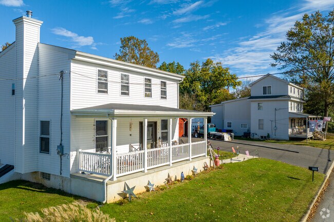 Colonial revivals line the main street of Harrisonville in South Harrison Township.