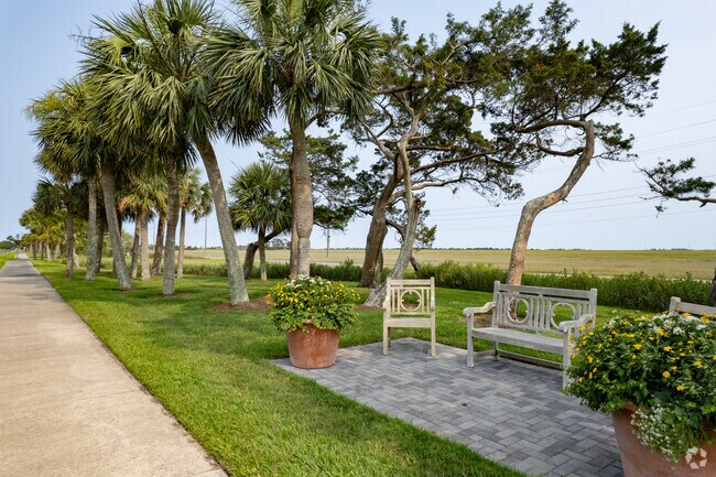 Bike paths and shaded seating line the entrance to Sea Island.