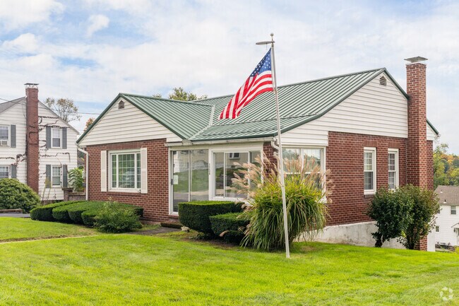 The ranch homes. of Oakland proudly show off their patriotism on neatly manicured lawns.
