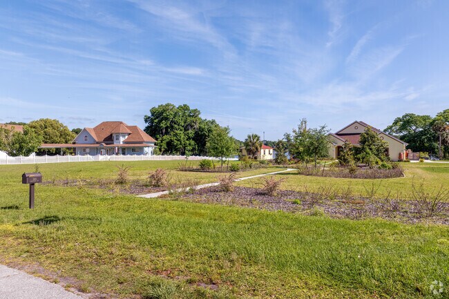 Large two-story homes on the lakefront feature sprawling front yards in Umatilla.