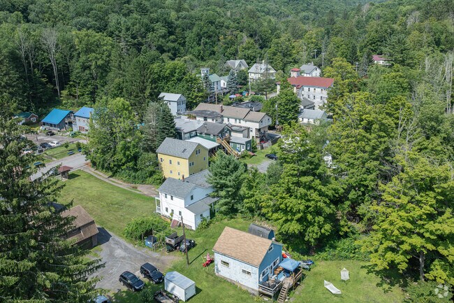 Pine Hill is surrounded by nature, with trees between houses.