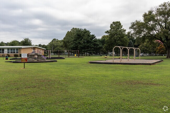 Lulu Ross Elementary School has a nice larged fenced in playground.