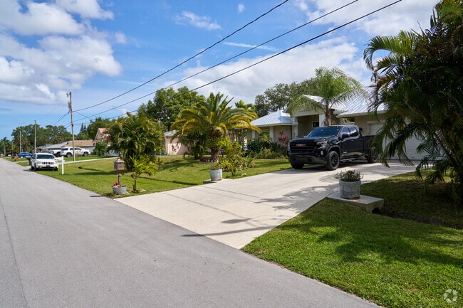 Trees line the streets and surround properties in the Hidden Oaks neighborhood.