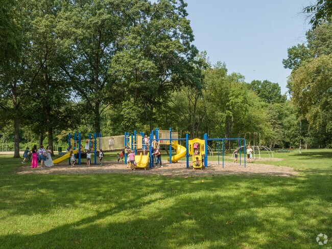Children enjoying the playground at John Stymelski Veteran's Park in SMB Estates, Livonia.