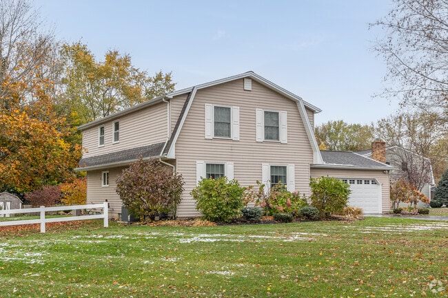 A modern Barn-style home with a garage on Kevington Place in Boston, NY.