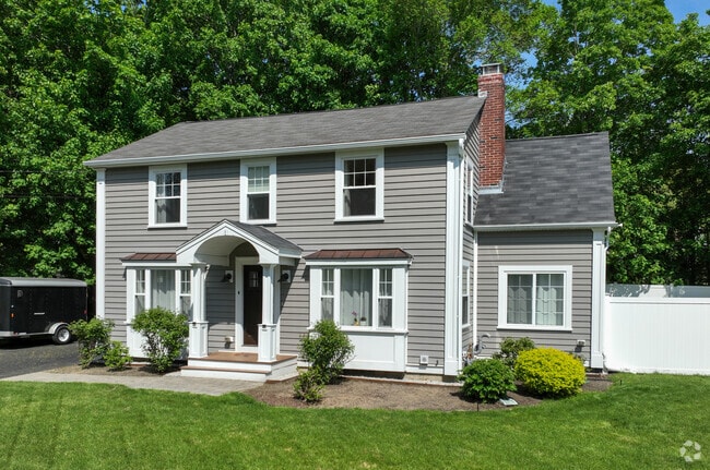 Pine Hill boasts elegant Colonial-style homes, with their stately facades and symmetrical designs, creating a timeless and refined atmosphere throughout the neighborhood.