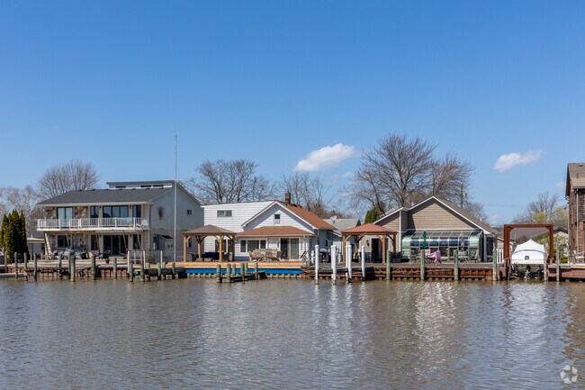 Harrison Township homes with docks overlook the Clinton River.