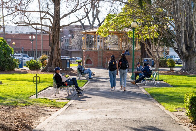 Residents enjoy sunny days at Watsonville's City Plaza and Park.