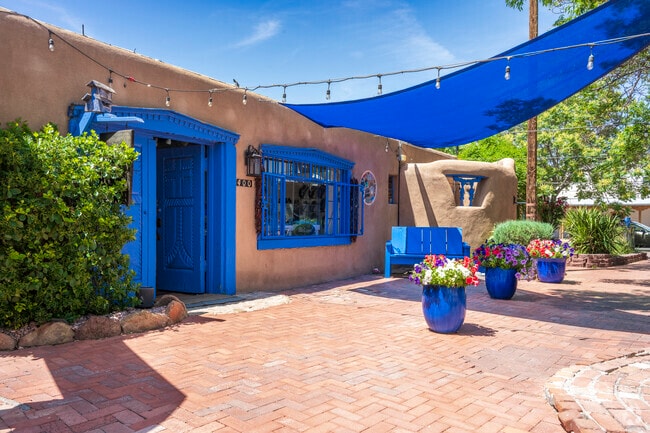 Adobe walls and distinctive blue doors and windows can be found all over Huning Castle.