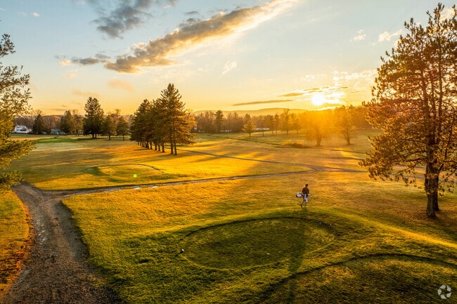 The sun sets over a golfer at the Monoosnock Country Club in Leominster.