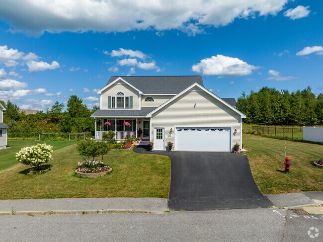 A quaint cape cod home nestled in a newer neighborhood in the town of Hooksett.