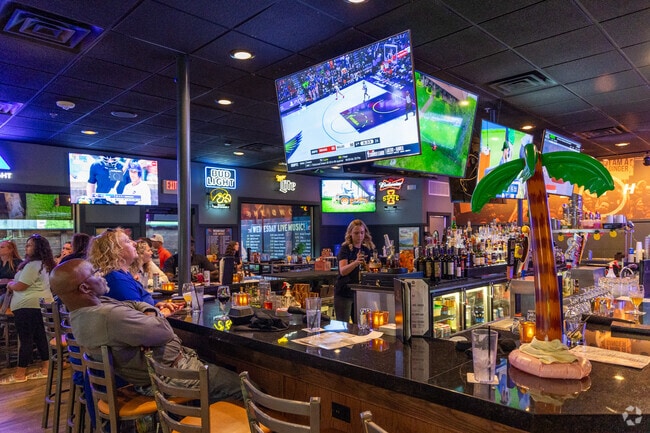 Locals watch the game and grab a bite at Gilroy’s Kitchen in Waveland Woods.