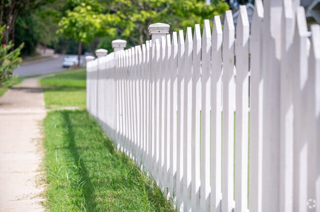 White picket fences line the sidewalks in Crestwood North.