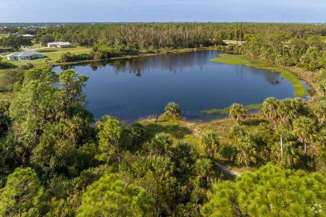 Yellow Fever Creek Preserve Cape Coral has a small pond as it's centerpiece stocked with fish.